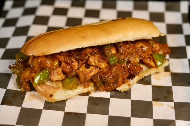 Butter Chicken Cheesesteak w/Fries.